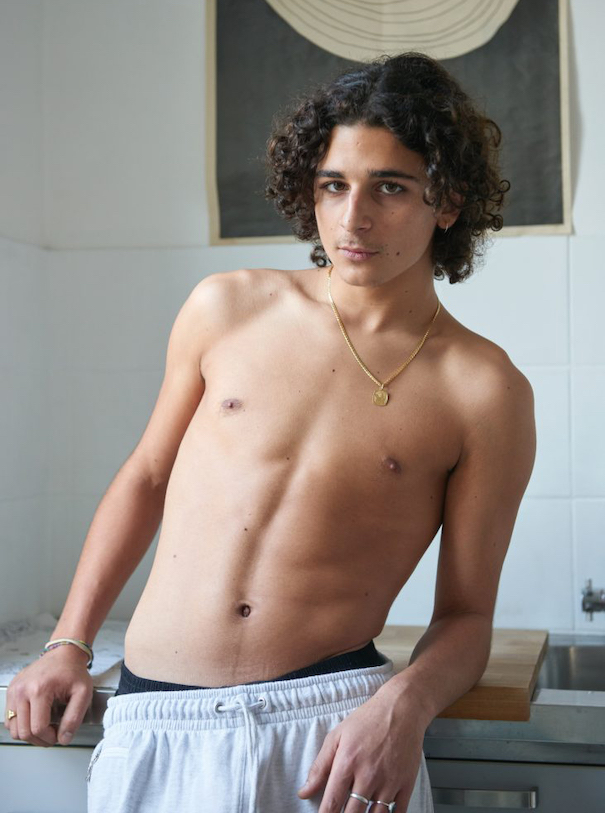 Kira Bunse- Tour de France3 Kira Bunse Tour de France Model Apartment Photography no shirt brown curly hair grey sweatpants