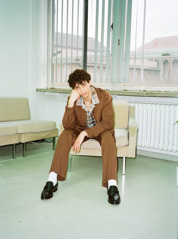 Sissi Goetze_Image1 Sissi Goetze Brown Suit Campaign Model sitting office