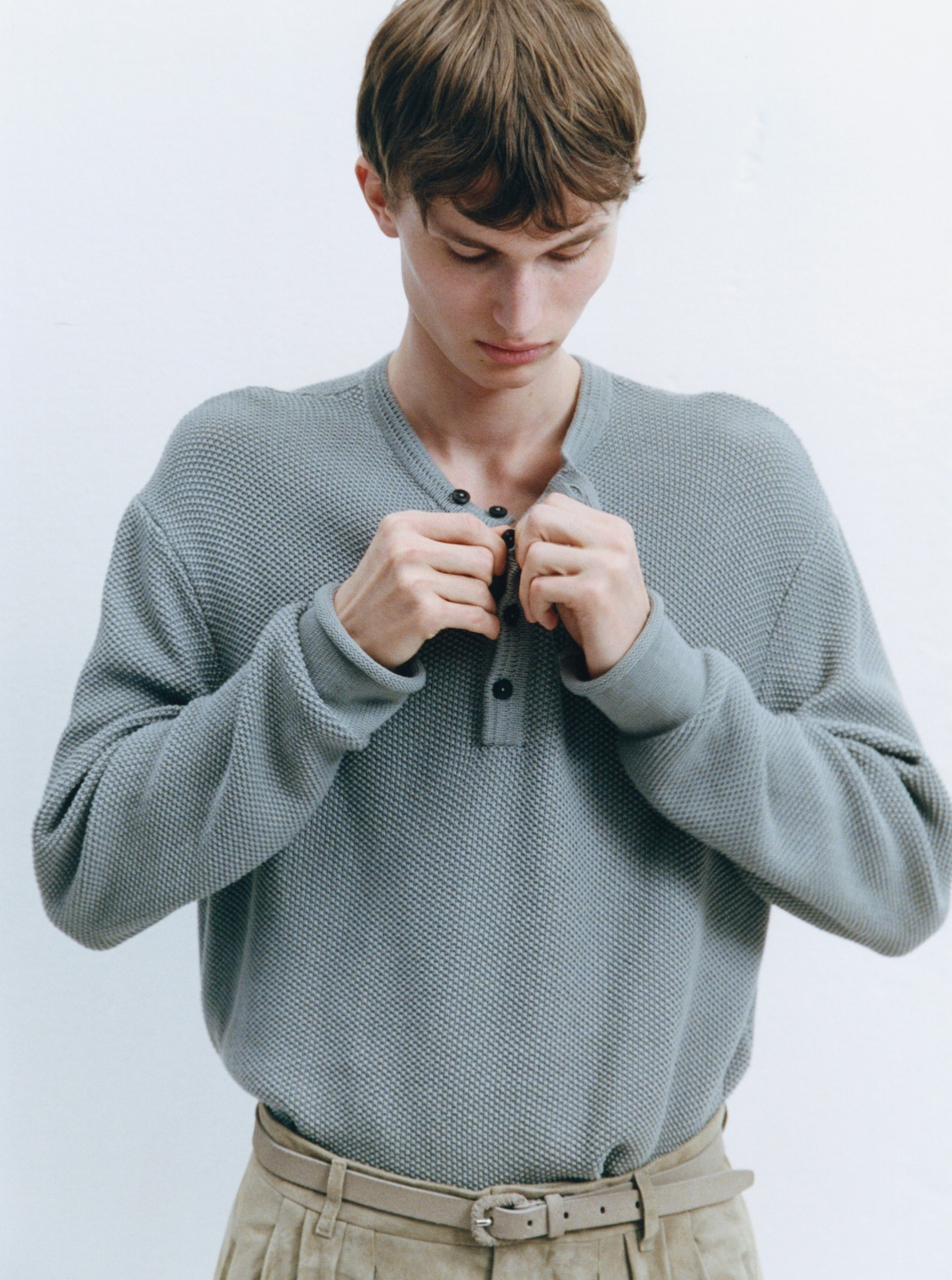 35 Male model dressing for ACHTUNG 51 behind the scenes shoot