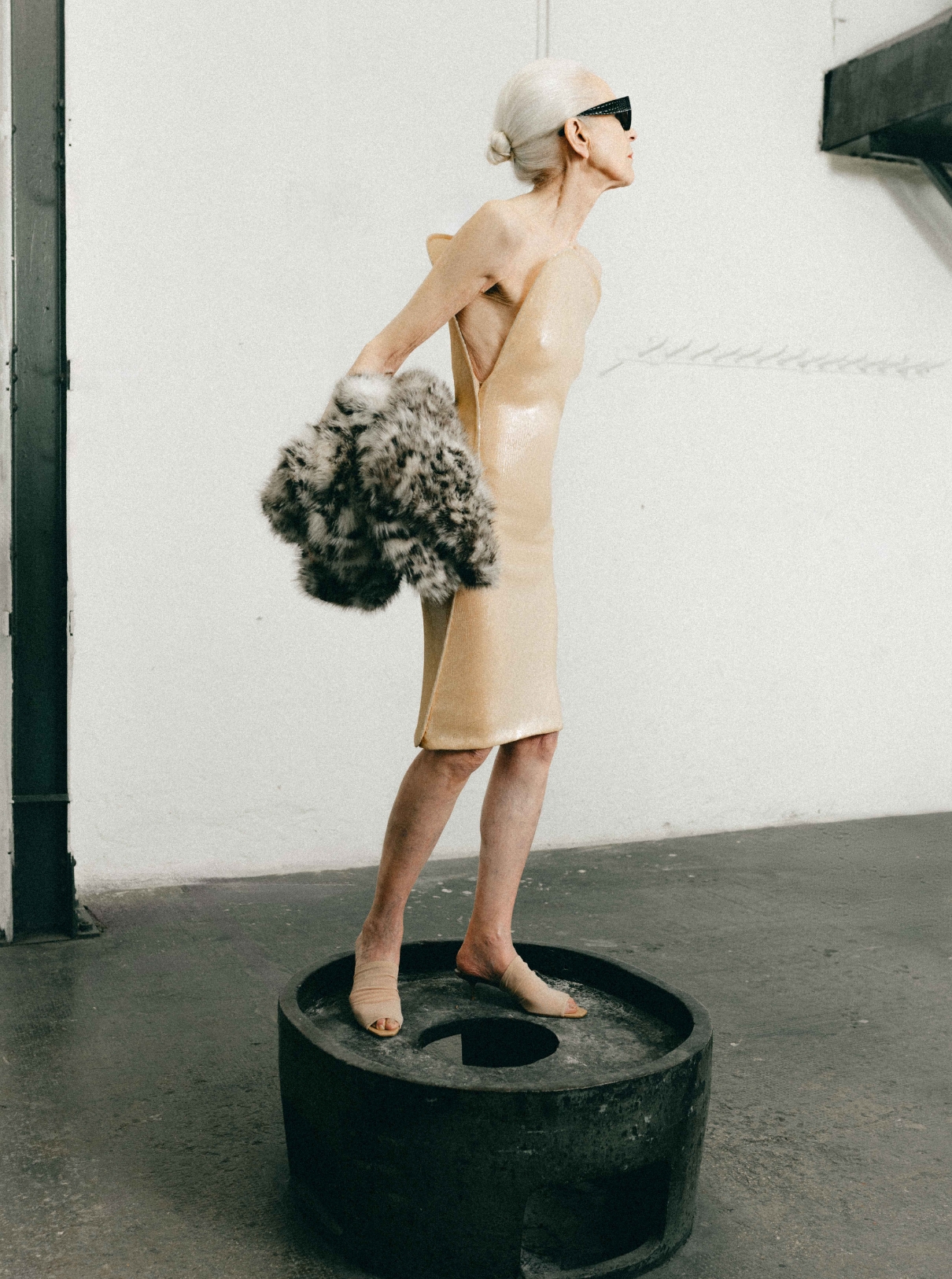 50 Dress and shoes COURRÈGES; Jacket ISABEL MARANT; Glasses ALAÏA