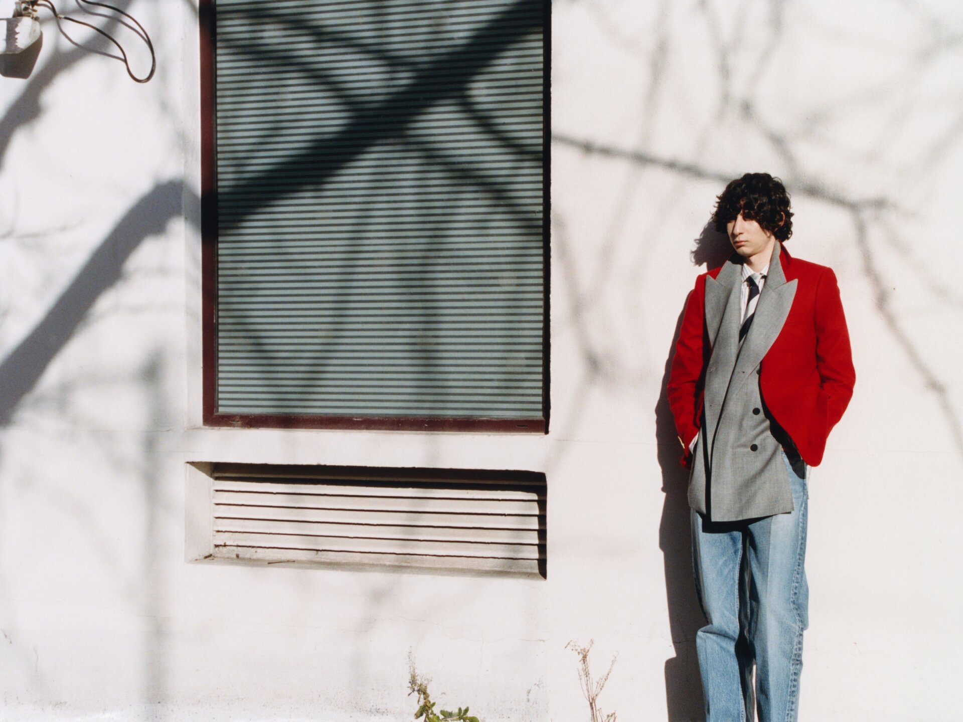 9 Male model behind the scenes taking a break between shooting for ACHTUNG 51: Das Model