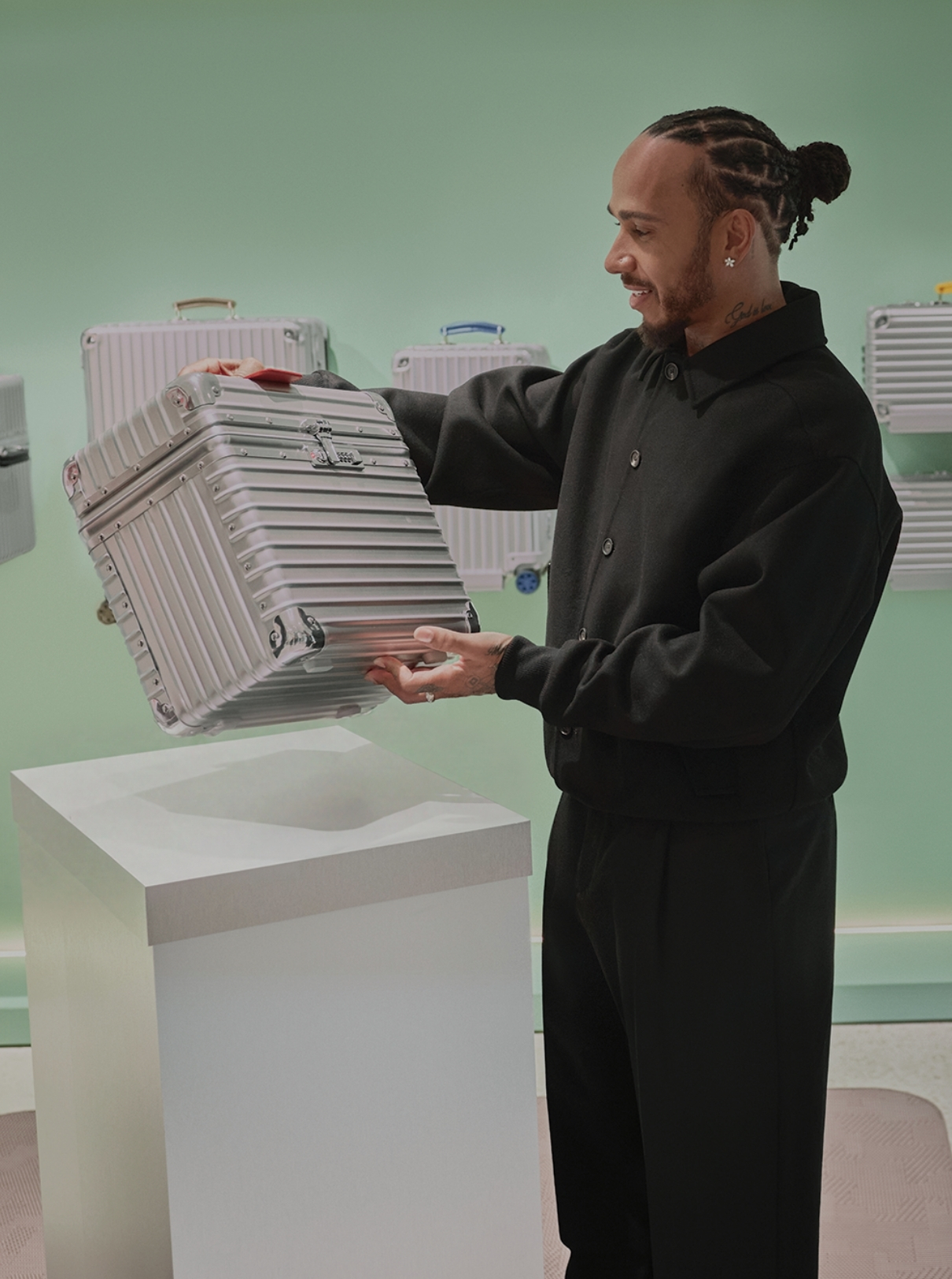 Rimowa aficionado Lewis Hamilton at the store opening 